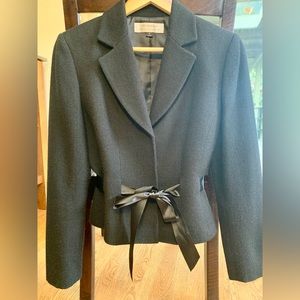 Black, wool skirt suit with satin black ribbon belt, size 6. Blazer & skirt